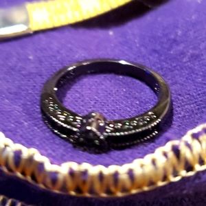 Slim fashion jewelry ring...black..size 7 to 7.5 small stone brand new